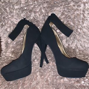 Woman’s black platform heel with ankle strap